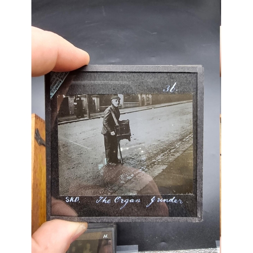 152 - MAGIC LANTERN SLIDES: LONDON STREET CHARACTERS: an unusual group of 50 uncoloured photographic lante... 