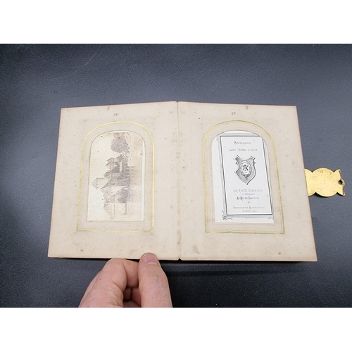 160 - CARTE DE VISITE: a small format cdv album, calf backed mother of pearl boards with engraved brass cl... 