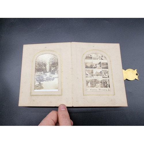 160 - CARTE DE VISITE: a small format cdv album, calf backed mother of pearl boards with engraved brass cl... 