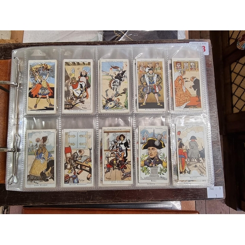 302 - CIGARETTE CARDS: a modern album containing a quantity of cigarette cards, including examples by Mitc... 