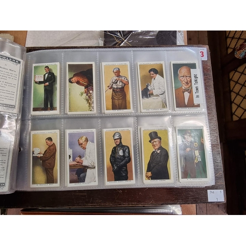 302 - CIGARETTE CARDS: a modern album containing a quantity of cigarette cards, including examples by Mitc... 