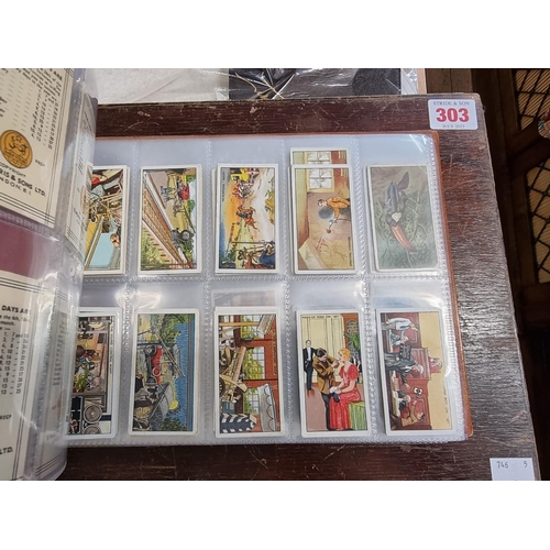 302 - CIGARETTE CARDS: a modern album containing a quantity of cigarette cards, including examples by Mitc... 