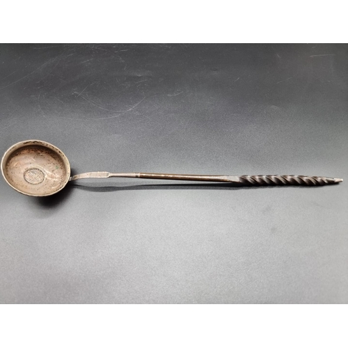 582 - A Georgian silver and baleen toddy ladle, with coin inset bowl, 34.5cm.... 