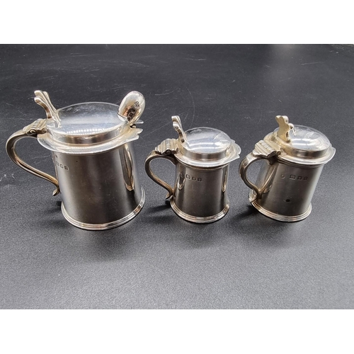 636 - An unusual silver novelty tankard form three piece cruet set, by Charles Boyton & Son Ltd, Londo... 