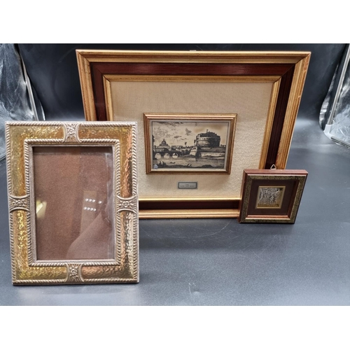 681 - A modern rectangular photograph frame, stamped 925, 18 x 14cm; together with two framed white metal ... 