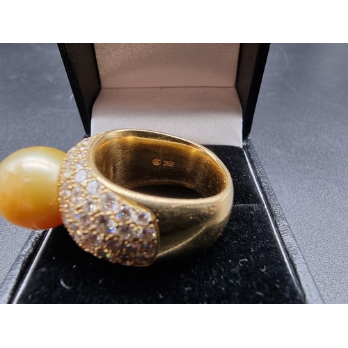 682 - A yellow metal ring, set South Sea golden pearl and pave set diamonds, stamped AK 750, size N-O, gro... 