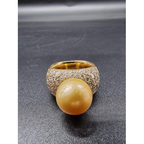 682 - A yellow metal ring, set South Sea golden pearl and pave set diamonds, stamped AK 750, size N-O, gro... 