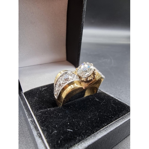 685 - A yellow metal and diamond cocktail ring, the principal stone approximately 1.2ct, set with ten othe... 