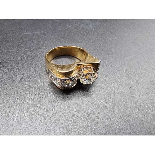 685 - A yellow metal and diamond cocktail ring, the principal stone approximately 1.2ct, set with ten othe... 