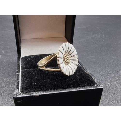 688 - A Georg Jensen gold plated and white enamel Daisy ring, stamped 925, designed by Anton Michelsen, si... 