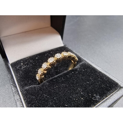 698 - A yellow metal diamond half eternity ring, stamped 14k, size N.