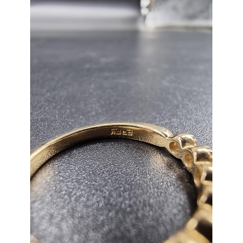 698 - A yellow metal diamond half eternity ring, stamped 14k, size N.