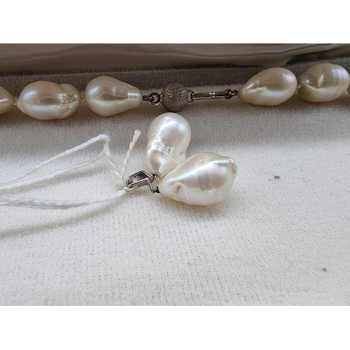 711 - A freshwater baroque pearl single strand necklace, with clasp stamped 750, 42.5cm; together with a s... 