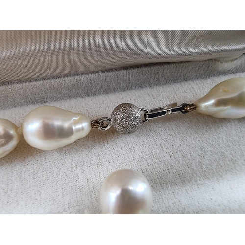 711 - A freshwater baroque pearl single strand necklace, with clasp stamped 750, 42.5cm; together with a s... 