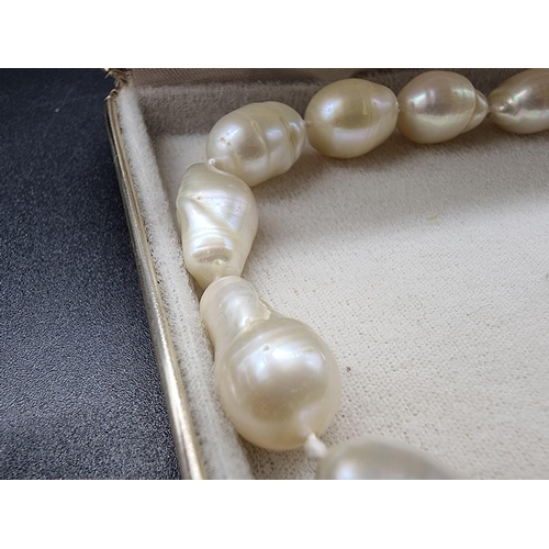 711 - A freshwater baroque pearl single strand necklace, with clasp stamped 750, 42.5cm; together with a s... 