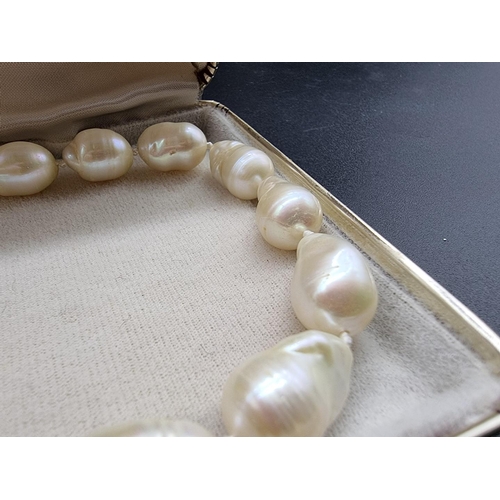 711 - A freshwater baroque pearl single strand necklace, with clasp stamped 750, 42.5cm; together with a s... 