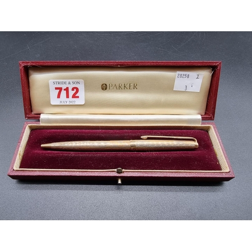 712 - A cased 9ct gold Parker 61 Presidential Waterdrop pattern ball point pen, hallmarked London 1966.... 