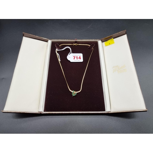 714 - An 18ct gold diamond and emerald necklace, 40cm, gross weight 9.8g.