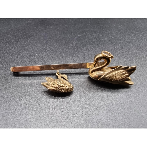 717 - A 9ct gold tie pin decorated pendant swan, by G&P, Birmingham 1929, 6cm; together with a similar... 