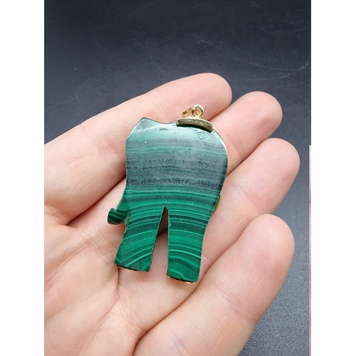 718 - A carved malachite elephant pendant, 43mm high.