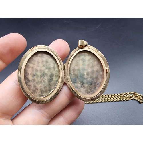 722 - A 9ct gold oval locket, 38mm, on a 9ct gold belcher necklace chain, 25g.