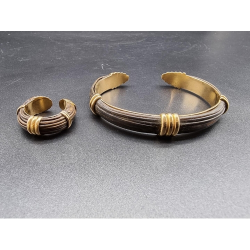 788 - A yellow metal and elephant hair flexible bangle, 7.5cm; together with matching ring. (2) WITHDRAWN ... 