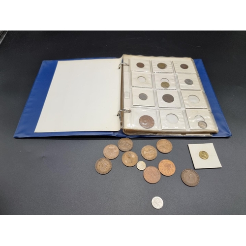 957 - Coins: an album of UK and world coins, to include a George V 1935 rocking horse crown.... 