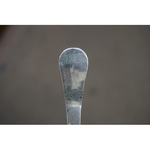 584 - An unmarked white metal spoon, having chased decoration to terminal and bowl back, 17cm.... 