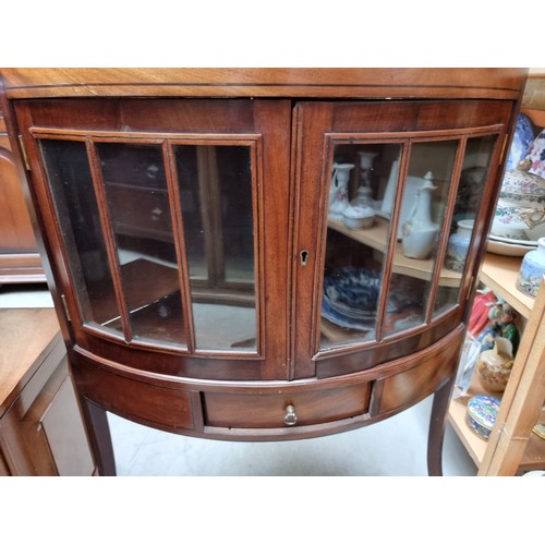 1075A - An Edwardian mahogany bowfront standing corner display cabinet, having two pairs of ebony strung ast... 