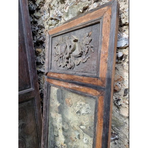 1000 - An antique continental oak two door cupboard, having a pair of glazed doors, 230cm high x 111.5... 