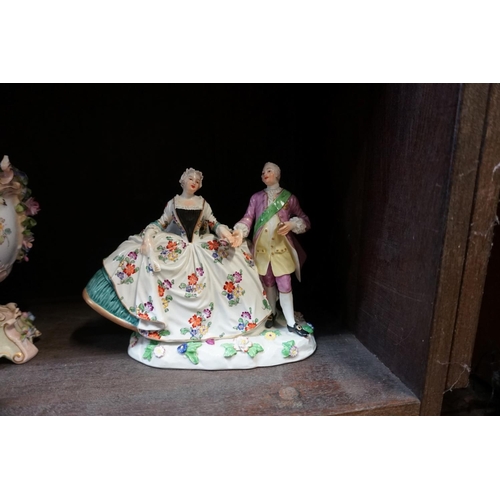 1105 - A Continental porcelain figure group, 18cm wide; and others.