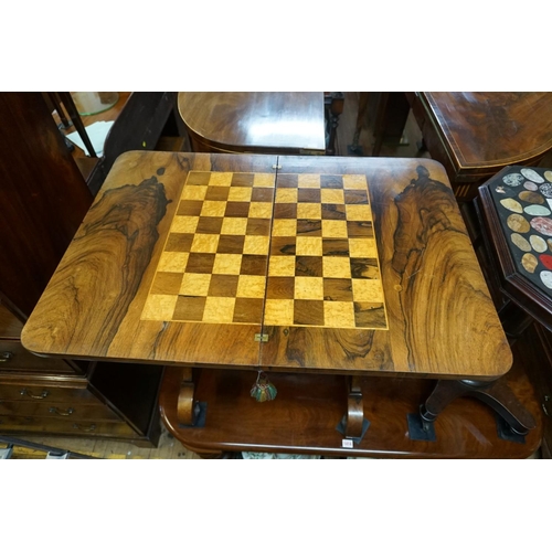 1375 - A Victorian rosewood combination games work table, the foldover top with chequerboard inlay, 78... 