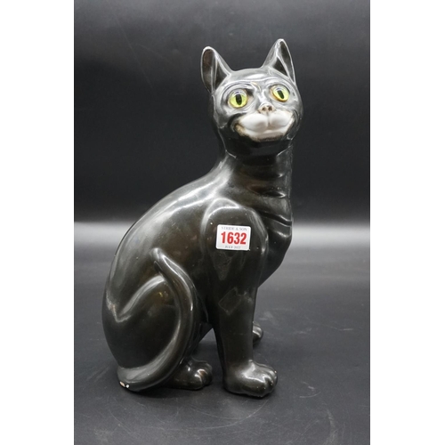 1590 - A Galle black glazed faience cat, signed, with green glass eyes, 36cm high, (s.d).