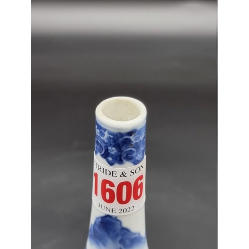 1634 - A Chinese blue and white bottle vase, Kangxi four character mark to base, 20cm high, on hardwood sta... 