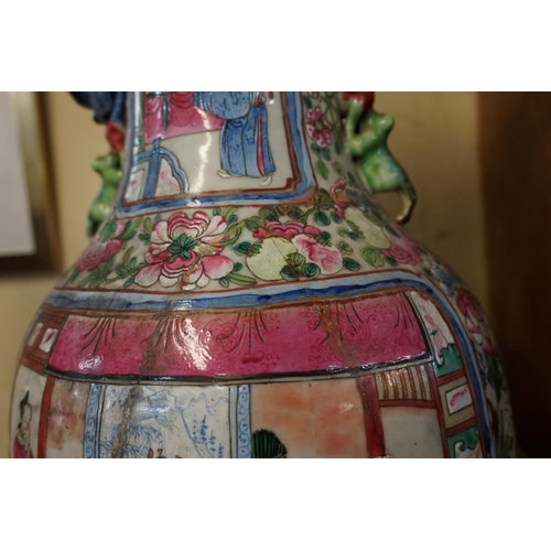 1689 - A large Chinese twin handled famille rose vase, late 19th century, 61.5cm high, (repaired).... 