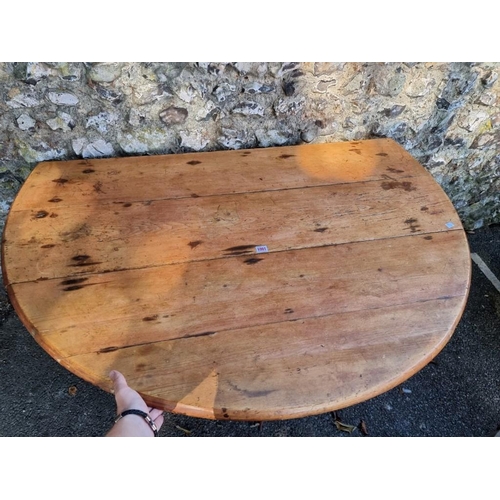 1001 - An antique pine dropleaf table, 136cm wide x 70cm high.