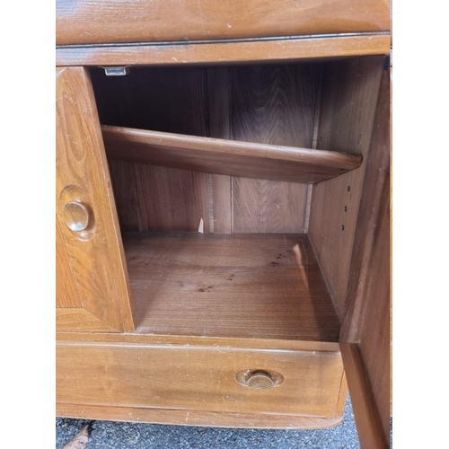 1023 - An Ercol bureau, 82.5cm wide x 43cm deep x 110cm high.