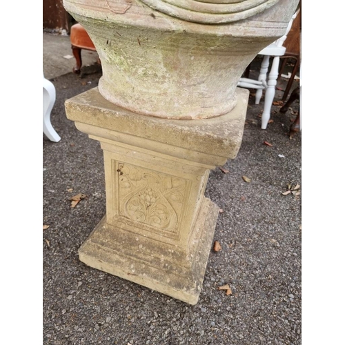 1032 - A terracotta urn on associated pedestal.