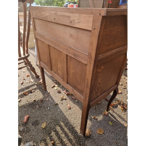 1035 - A continental carved oak bureau, 80cm wide x 43cm deep x 95cm high.