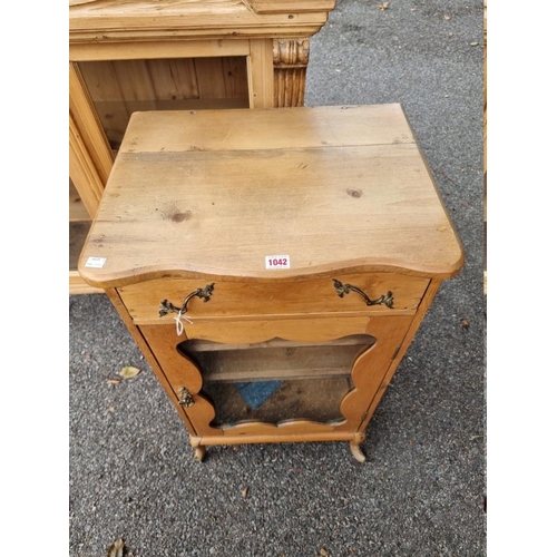 1042 - An antique pine side cabinet.