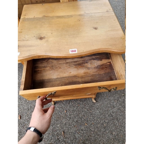 1042 - An antique pine side cabinet.