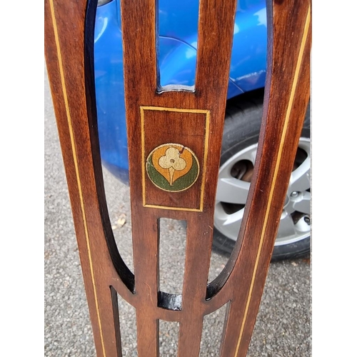 1049 - An Edwardian inlaid armchair; together with another armchair.