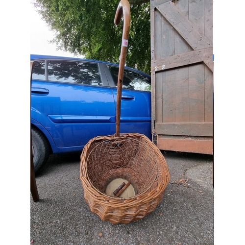 1050 - An old wicker trolley; together with a wirework waste paper bin.