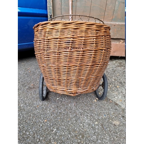 1050 - An old wicker trolley; together with a wirework waste paper bin.