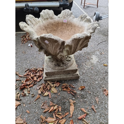 1053 - A reconstituted stone garden pedestal urn, 55cm x 55cm.