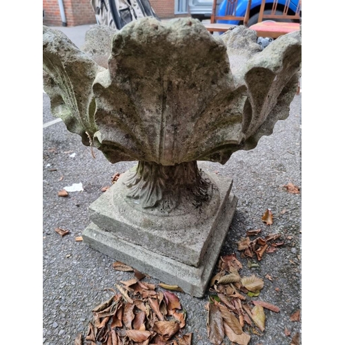 1053 - A reconstituted stone garden pedestal urn, 55cm x 55cm.