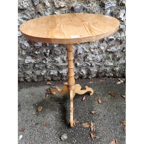 1054 - A small pine tripod table, 54cm wide x 78.5cm high.