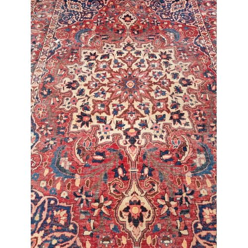 1057 - A small Persian carpet, having central floral cartouche, with cartouches to each corner and flo... 