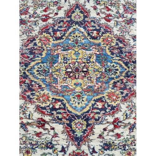 1060 - A Persian rug, having central floral cartouche, 188cm x 125cm.