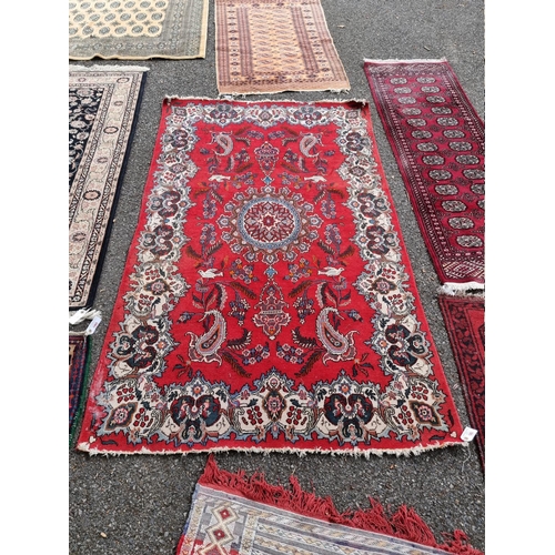 1063 - A Persian rug, having central floral medallion, decorated with birds and floral cartouche, 212c... 